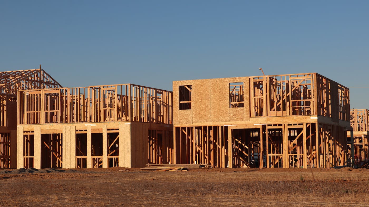 Brand-new homes under construction ready for cabinet installation.